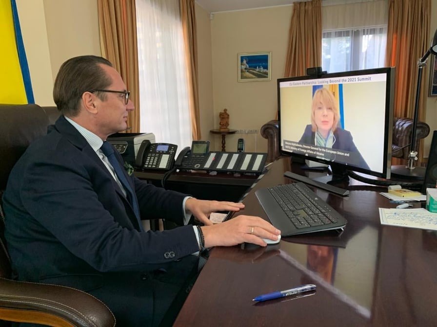 Image may contain: 2 people, people sitting and indoor